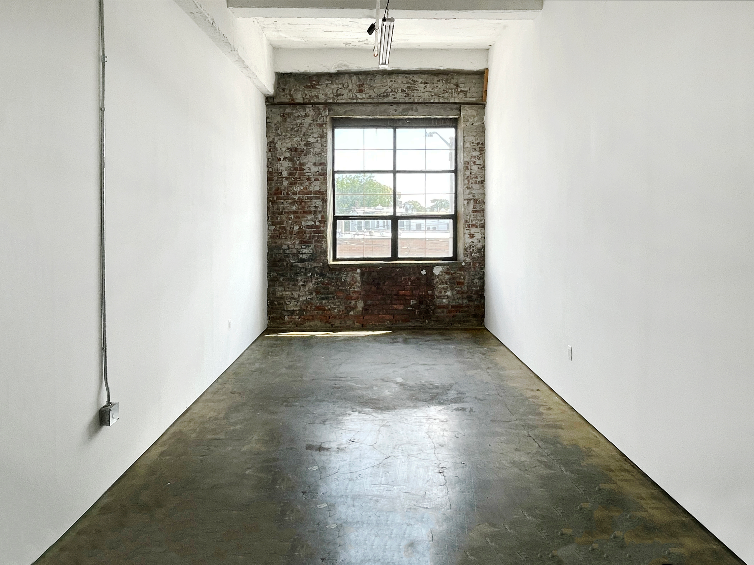 STUDIO 214: RIDGEWOOD ART STUDIO W BRICK WALL & INDUSTRIAL WINDOW