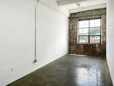 STUDIO 214: RIDGEWOOD ART STUDIO W BRICK WALL & INDUSTRIAL WINDOW